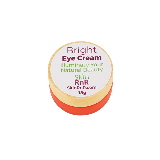 A plant-based brightening eye cream in an orange jar with a natural wooden lid, labeled “Bright Eye Cream – Illuminate Your Natural Beauty” by Skin RnR. Perfect for hydrating and rejuvenating tired eyes.