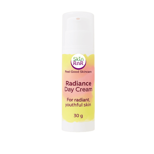 A white bottle of Skin RnR Radiance Day Cream with a pink and yellow label, a brightening plant-based moisturizer for radiant, youthful skin.