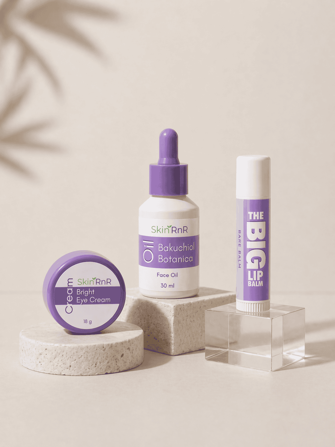 Bakuchiol face oil, bright eye cream, and lip balm from a Mother’s Day skincare gift set displayed on neutral background