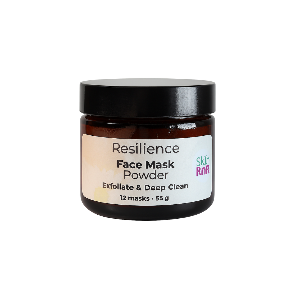 An amber jar of Skin RnR Resilience Face Mask Powder with a black lid and white label, a natural exfoliating mask that deeply cleanses pores and revitalizes skin for a smooth, renewed glow.
