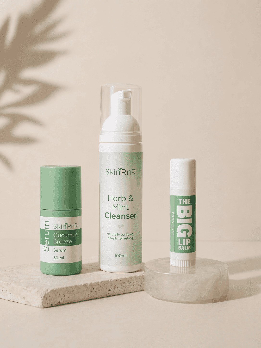 Cleanser, hydrating serum, and lip balm from a fresh and clean Mother’s Day skincare gift set on a neutral background